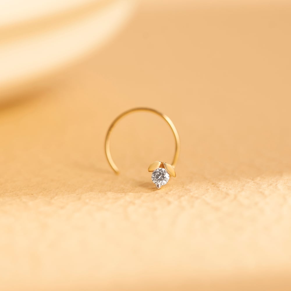 Flowerbud Gold and Diamond Nose Pin
Flowerbud Gold and Diamond Nose Pin