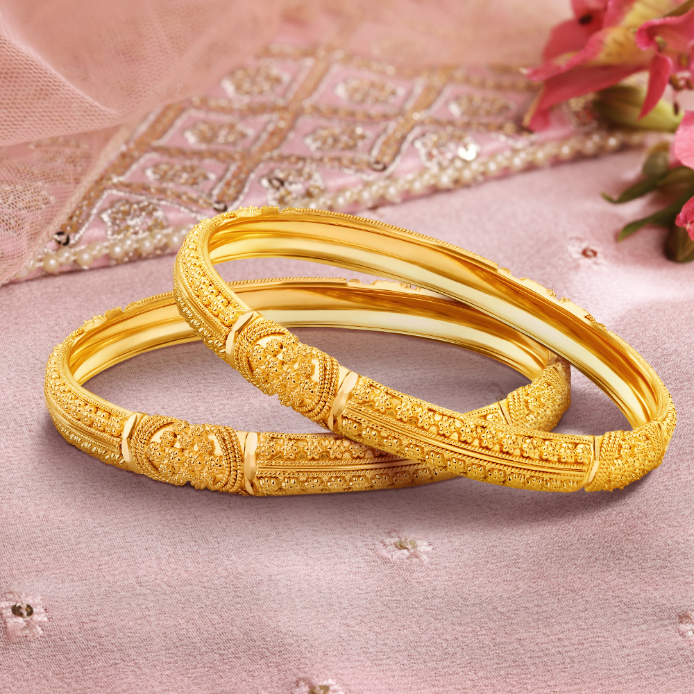 

Intricate Charm Gold Bangles