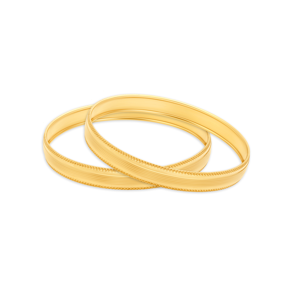 Austere Yellow Gold Furrowed Bangles