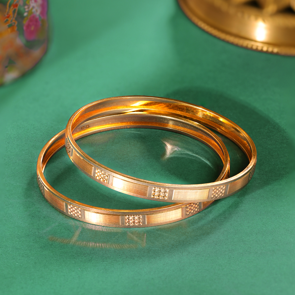 Modish Yellow Gold Carved Bangles