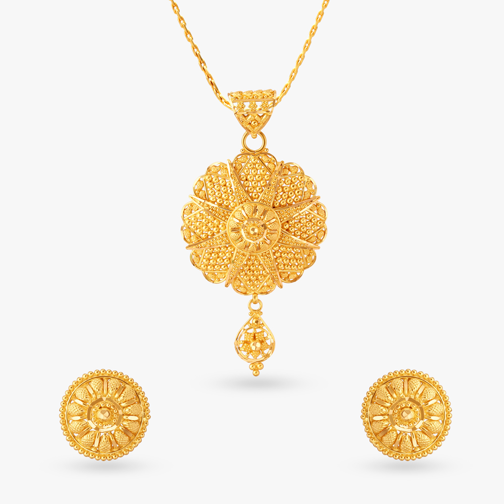 

Vintage-Charm Gold Pendant and Earrings Set