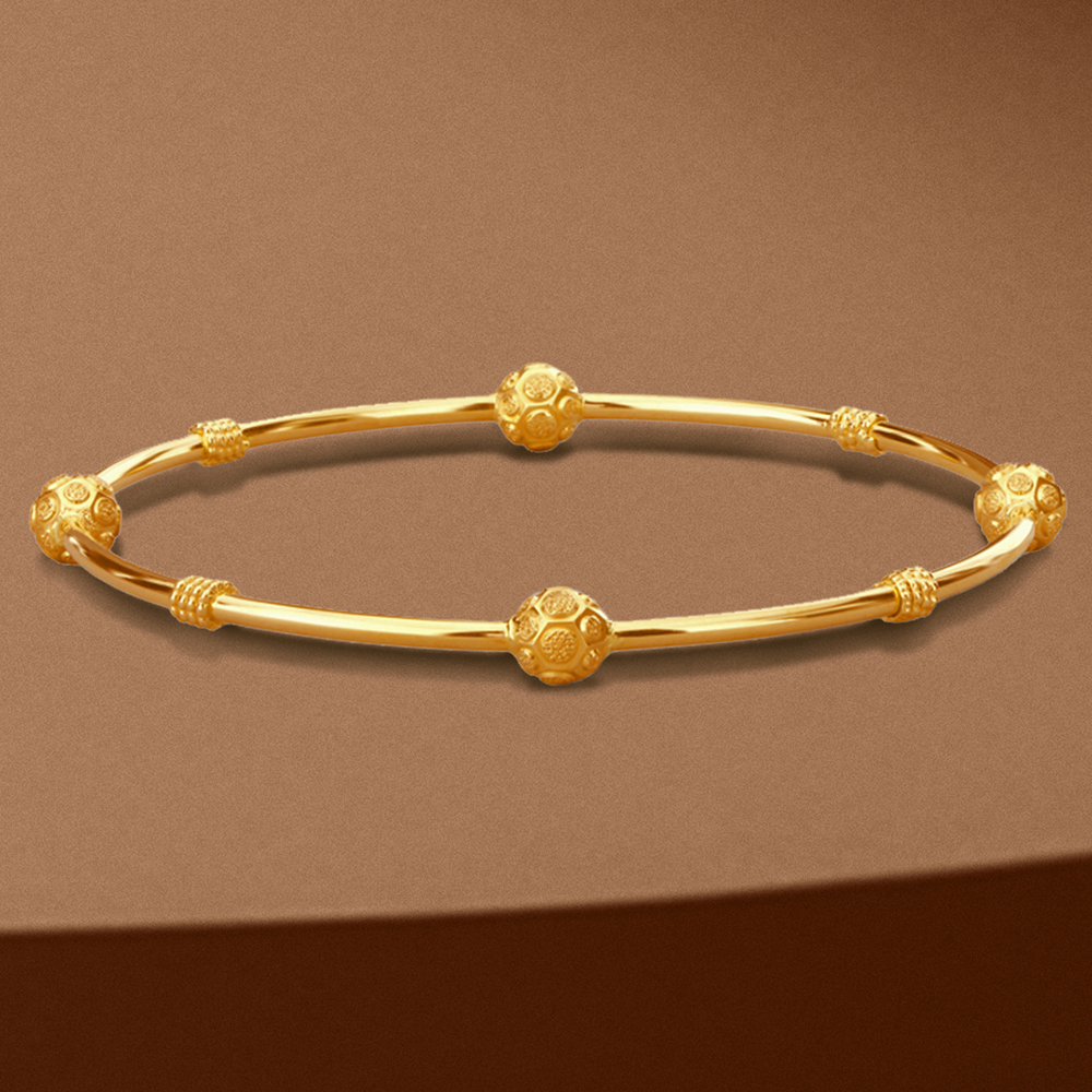 

Knurling Sphere Gold Bangle